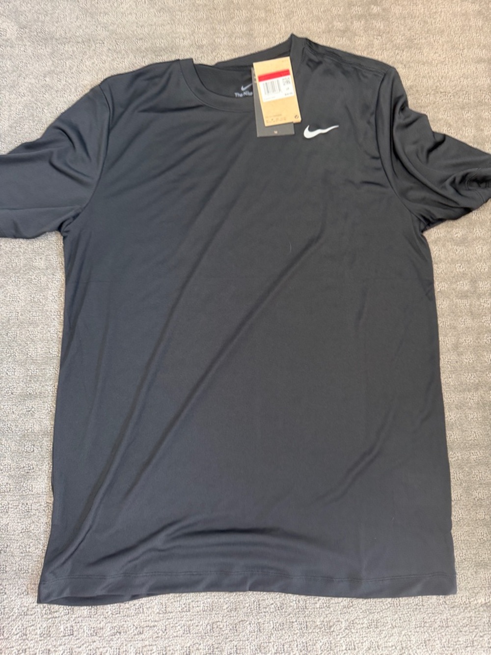 Nike Black Short Sleeve Athletic Tee with White Swoosh I have a navy one as wel